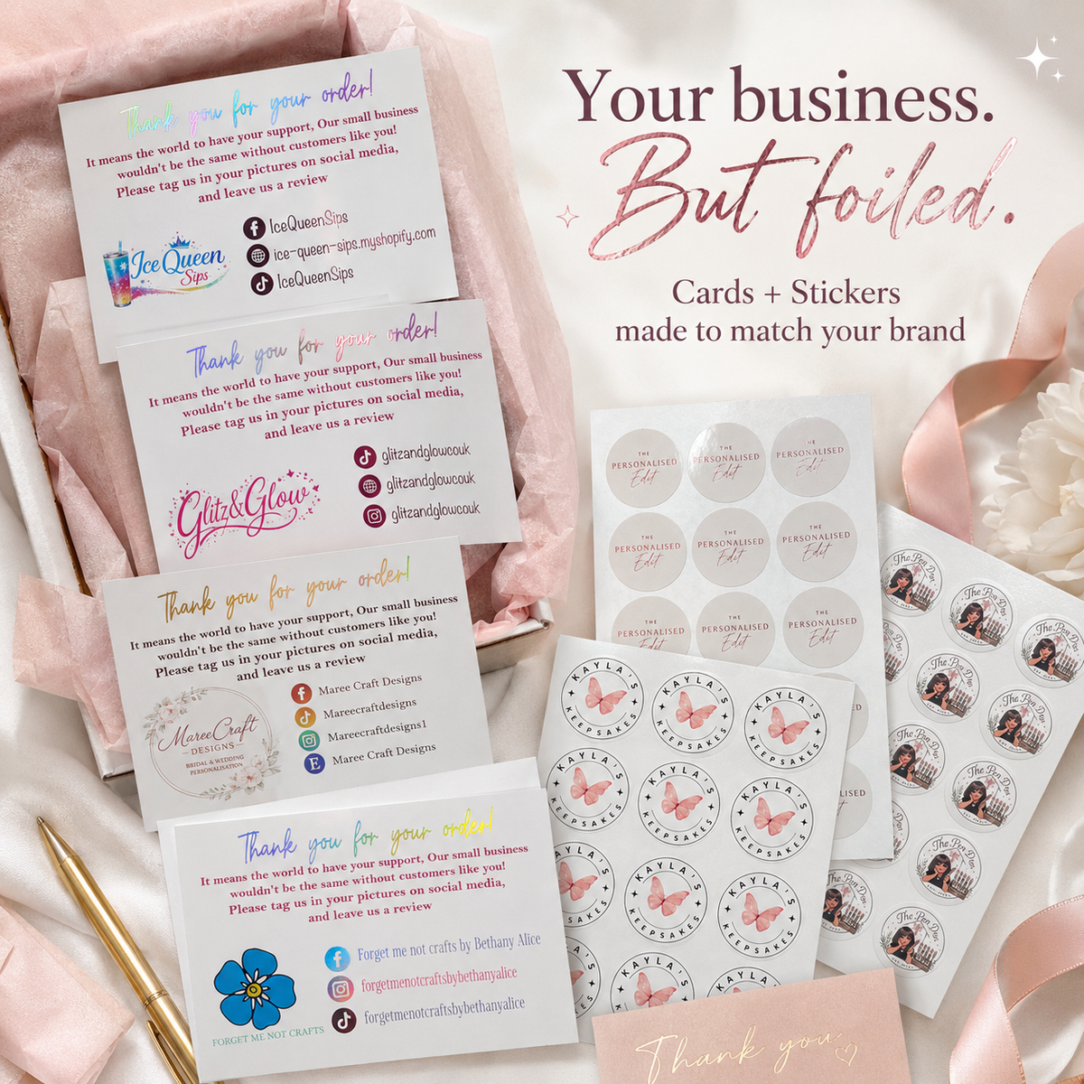A styled flat-lay of custom printed business cards and matching circular stickers on a pink fabric background. The cards feature placeholder branding like Ice Queen and Chilli Glaze, with pink and gold text, while the sheets show round stickers with butterfly and floral designs.