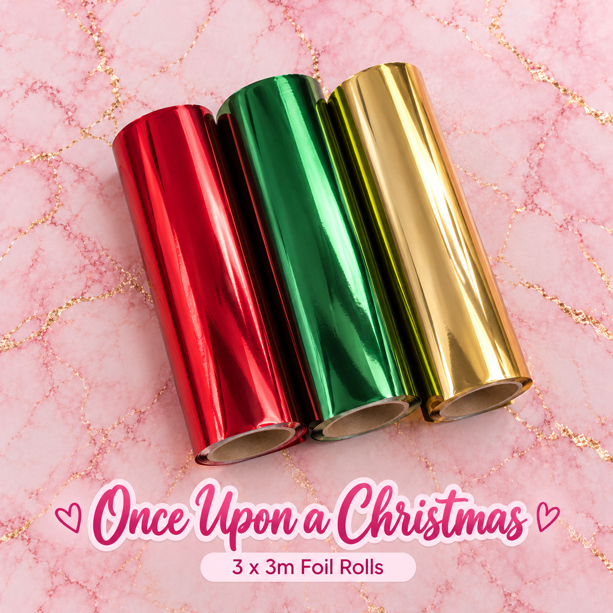 Once Upon a Christmas – three 3m toner reactive foil rolls in festive red, green and gold on pink marble