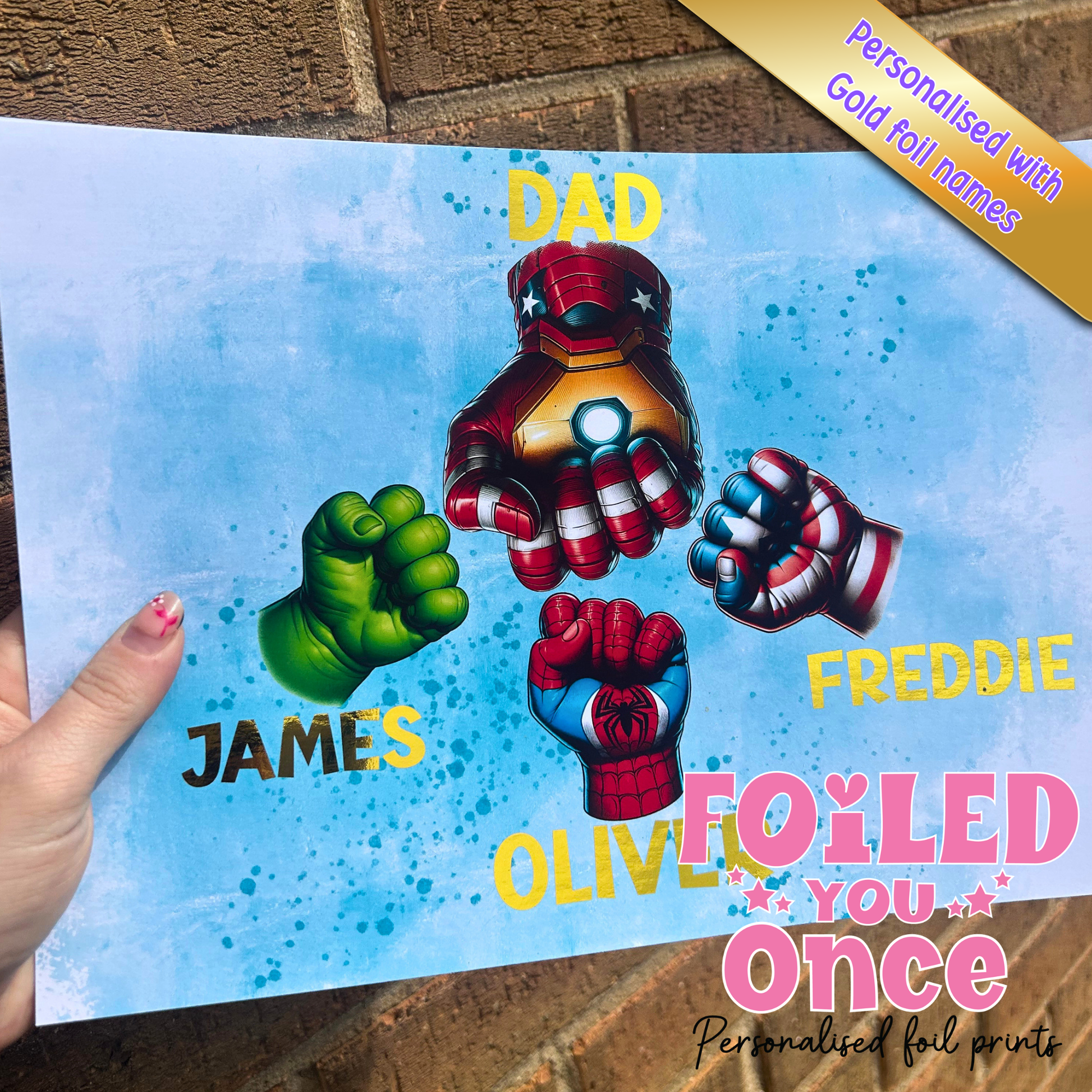 Personalised superhero dad fist bump A4 print with gold foil names, featuring family superhero hands and custom names for Dad and children