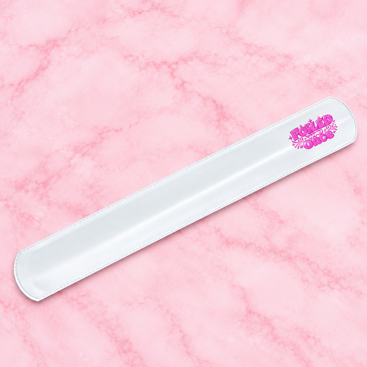 White Foiled You Once branded snap band on a pink marble background