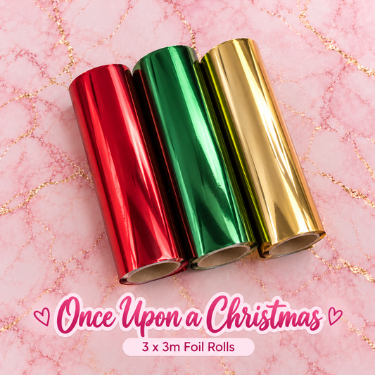 Once Upon a Christmas – three 3m toner reactive foil rolls in festive red, green and gold on pink marble